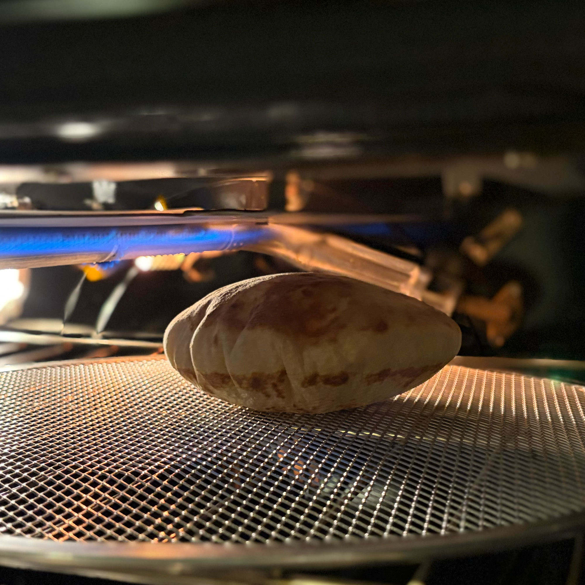 Naan puffing up under the broiler